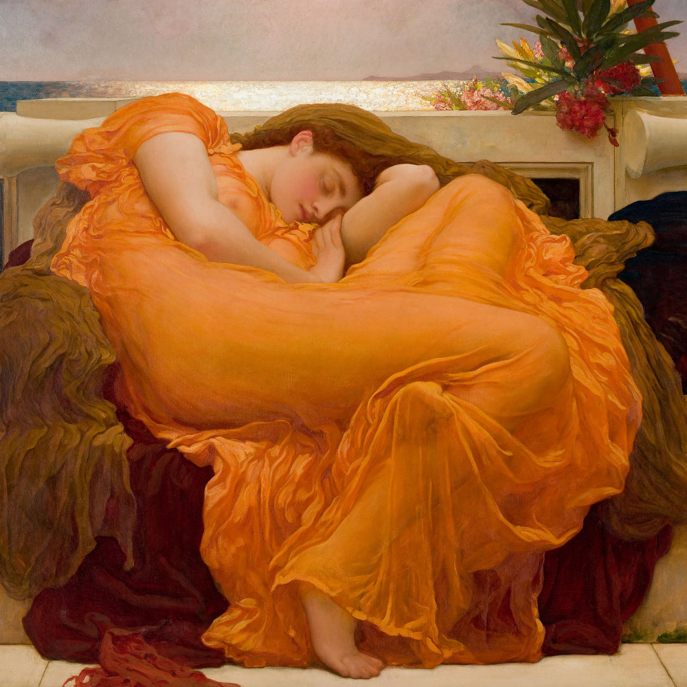 Woman in an orange dress lying on a couch with decorative elements in the background